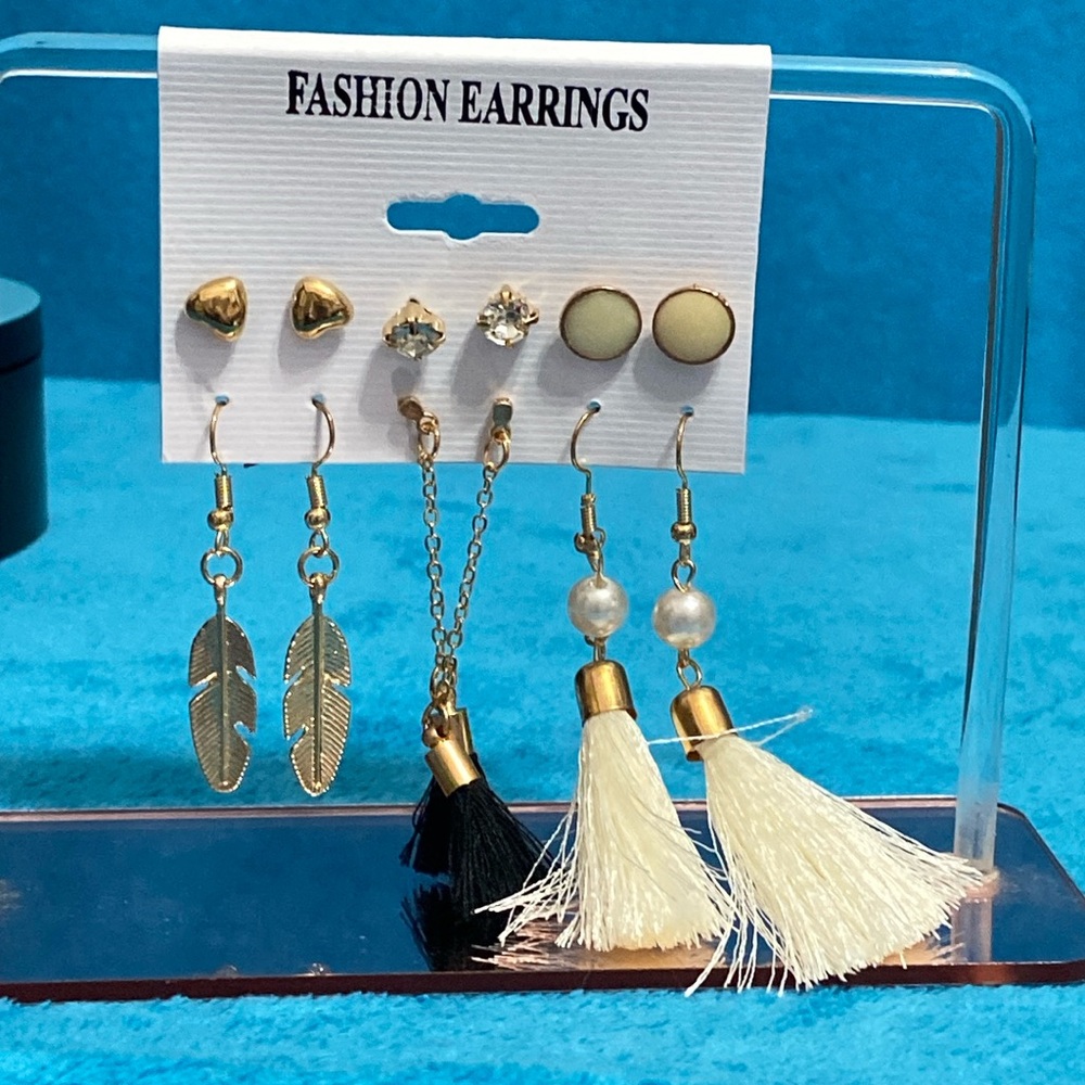 Brand new Eaering gold in color with white and black.